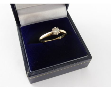 An 18 ct Gold Lady's Diamond Solitaire Ring, size M, appro 1.6 gms. 