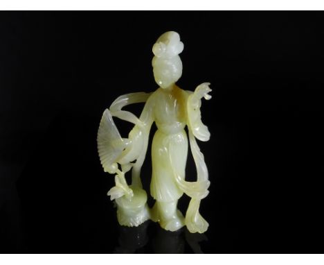 Chinese 20th Century Pale Celadon Jade Figure of Guanyin, the fine figure having ornately carved robes and a flower to her ha