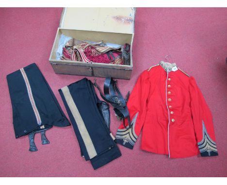 A Victorian British Army Majors Dress Uniform, comprising Red Tunic with buttons, two pairs of trousers, sword belt with 'una
