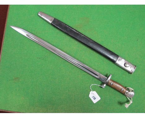 A 1907 Pattern British WWI Era Bayonet with Correct Scabbard, spring lock works, blade chrome plated.