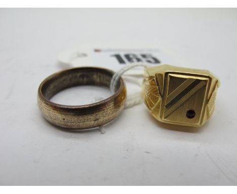 A Middle Eastern Style Gent's Ring, the high rectangular panel with inset highlight, (finger size O) stamped "750"; together 