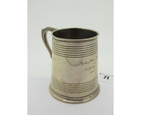 A Hallmarked Silver Christening Mug, Messrs Hutton, Birmingham 1912, of tankard form with reeded detail and inscribed "Anthon