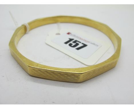 A Vintage Engine Turned Bangle, stamped "15ct", (internal diameter 7cm) (19 grams)
