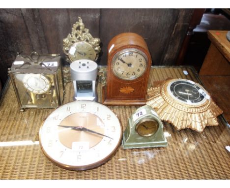 AN EDWARDIAN MANTEL CLOCK, a gilt "Sunburst" clock and similar clocks