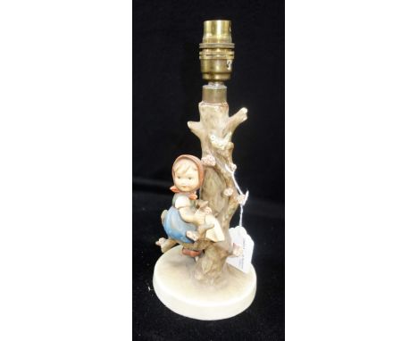 A HUMMEL TABLE LAMP decorated with a figure of a young girl