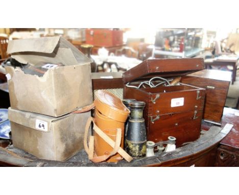 A VINTAGE BATTERY OPERATED "ELECTRIC SHOCK" MACHINE, two gas masks, a Vintage speaker, binoculars and sundries