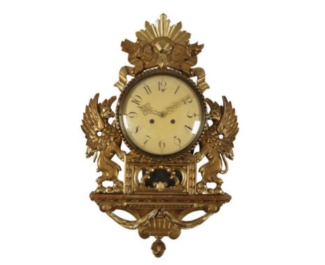 A GILTWOOD CARTEL WALL CLOCK, the 21cm convex dial with Arabic numerals, in a carved giltwood drop-dial case, the reverse mar
