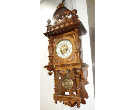 A LATE 19TH CENTURY WALNUT CASED WALL CLOCK with a brass drop dial