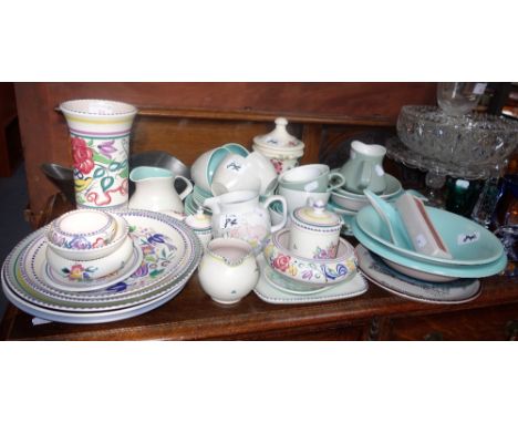 A TRADITIONAL POOLE POTTERY VASE and a collection of Poole pottery 