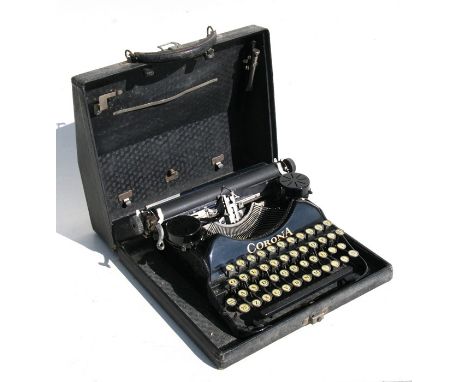A vintage Corona portable typewriter, cased, 33cms (13ins) wide.