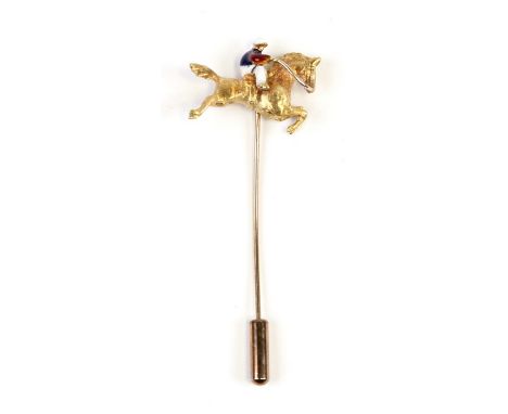 A yellow metal and enamel horse and jockey stick cravat pin, weight 4.3g.Condition ReportSoldered repair to reverse.