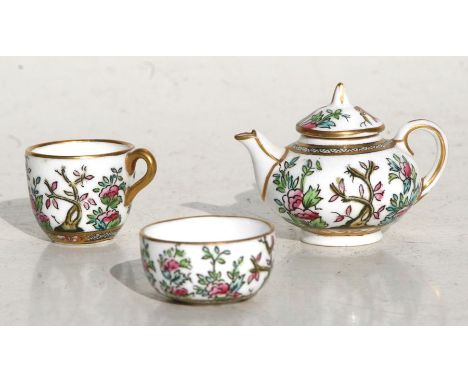 A Coalport Indian Tree pattern miniature teapot, tea cup and sugar bowl (3).