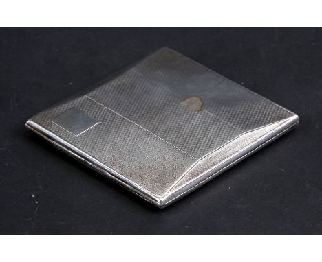 A silver cigarette case of shaped rectangular form with engine turned decoration, London 1931, weight 109g, 8cms (3.1ins) wid