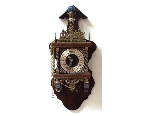 A modern Dutch style wall clock with gilt metal mounts, on a walnut bracket, 52cms (20.5ins) high.