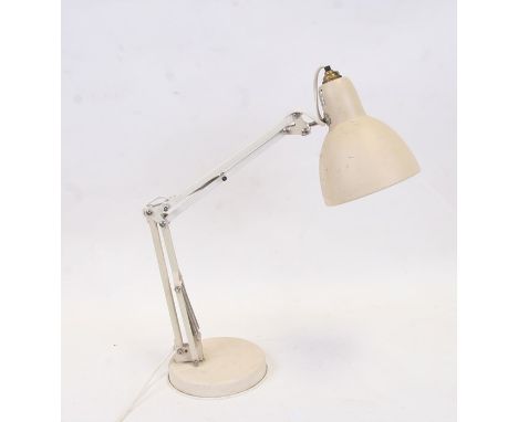 A mid century Anglepoise type table lamp with circular base and original painted finish.
