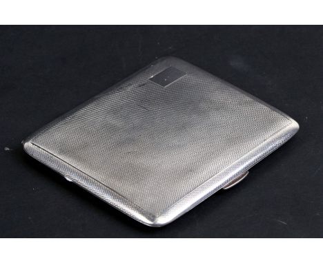 A silver cigarette case with engine turned decoration, Birmingham 1940, weight 105g, 9cms (3.5ins) wide.