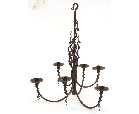 A gothic style wrought iron six-branch hanging ceiling light, 48cms (19in) wide.