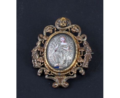 A 19th century gilt metal and enamel Renaissance Revival brooch with central figure holding a crucifix within a pierced figur