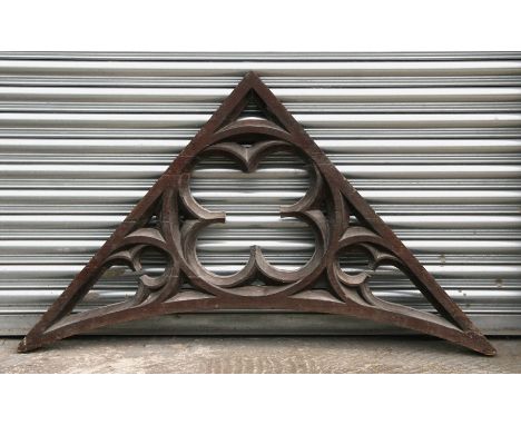 A Gothic architectural carved oak bracket, 138cms (54.5ins) wide.