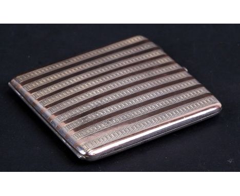 A silver cigarette case with silver and silver gilt repeating striped decoration, London 1921, weight 128g, 8cms (3.1ins) wid