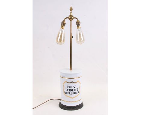 A 19th century chemist's jar - PULV SEIDLIZT WOOLLING'S - converted to a table lamp, 73cms (28.75ins) high.   Note:   Woollin