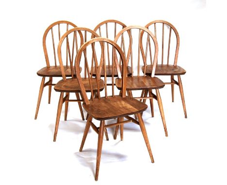 A set of six Ercol stick back chairs.