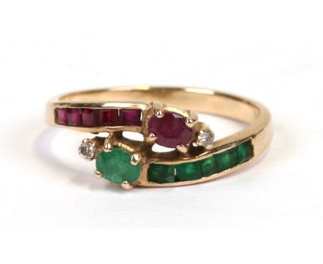 A 14ct gold diamond, ruby and emerald crossover ring, approx UK size 'M'.