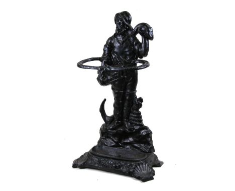 A cast iron stick stand in the form of a fisherman, 67cms (26.5ins) high.