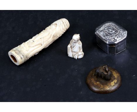 A Chinese white metal box decorated with a dragon, 5cms (2ins) wide; together with a Japanese ivory okimono of a seated figur