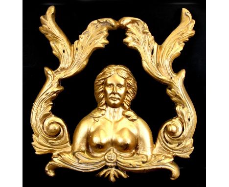 A composite decorative gilt plaque depicting a female bust within scrolling leaves, 55cms (21ins) wide.