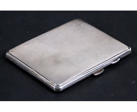 A silver cigarette case with engine turned decoration, Birmingham 1941, weight 127g, 9.5cms (3.75ins) wide.