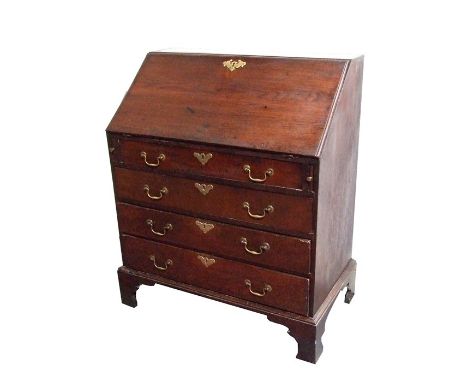 An early 19th century oak bureau, the fall-flap enclosing a fitted interior above four graduated long drawers, on bracket fee