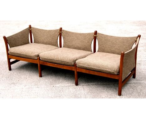 A mid century modernist oak framed &amp; upholstered three-seater sofa with loose cushions, 192cms (75.5ins) wide.