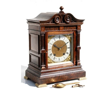 A George III style bracket clock with silvered chapter ring with Roman numerals, fitted with a 30-hour movement striking on a