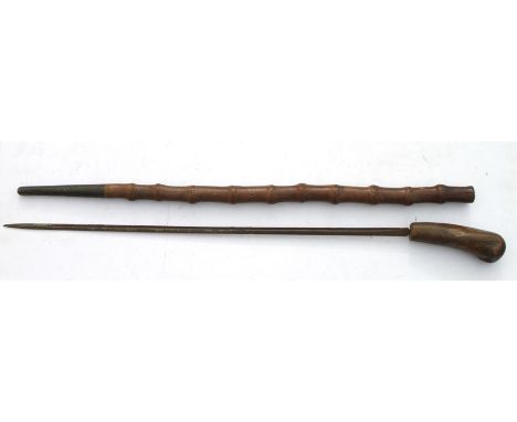 A 19th century cane sword stick with a 62cms (24.5ins) single edged blade