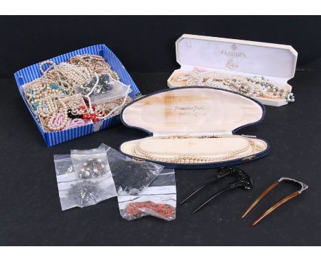 A quantity of costume jewellery to include stick coral and faux pearls.