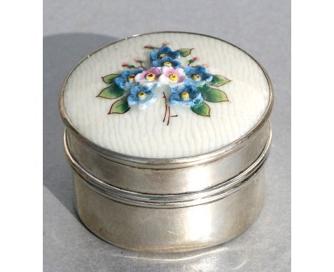 A George V silver circular pill box, the cover with floral enamel decoration, Birmingham 1925, weight 56g, 5cms (2ins) diamet