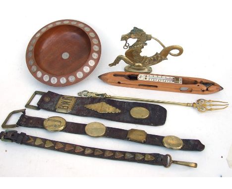 A Venetian brass seahorse gondola finial; together with a group of horse brasses; a coin set wooden bowl; and a loom shuttle 