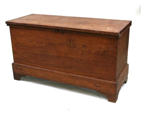 An early 19th century elm chest on bracket feet, 117cms (46ins) wide.Condition ReportTop has a split right across from side t