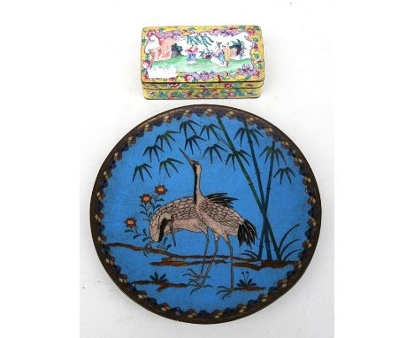 A Japanese cloisonne dish decorated with a pair of cranes on a blue ground, 25cms (9.75ins) diameter; together with a Chinese