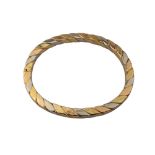 Continental, Circa 1980s, A three coloured 18 carat gold flattened twist bangle