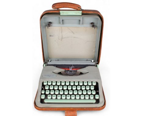 Herms Circa 1950 A baby typewriter In original brown leather case With two spools of new ribbon included  To be sold without 