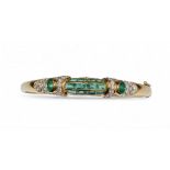 Chaumet, London, Circa 1980, An elegant 18 carat gold, calibrÈ emerald and diamond bangle