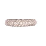 British, Circa 1990, A pavÈ set brilliant cut diamond half hoop ring