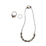 British, 20th Century, A Tateossian necklace and two rings