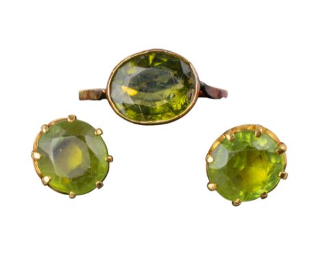 Continental Circa 1930 A pair of peridot and yellow gold ear studs and ring The mixed cut peridot within coronet yellow gold 