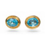 Contemporary, A pair of blue topaz and 18 carat yellow gold ear studs