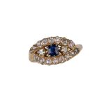 British, 19th Century, A sapphire and diamond crossover cluster ring