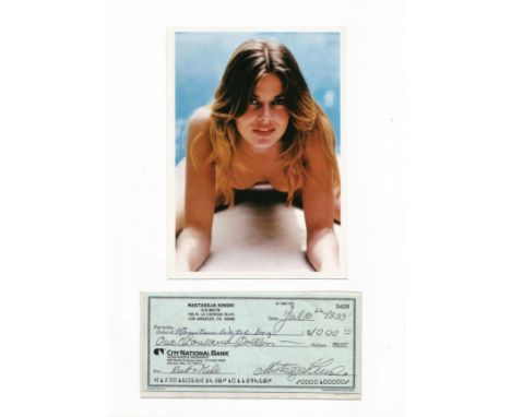 Natasha Kinski signed cheque stuck below colour photo on 12x8 white card. Good condition. All autographs come with a Certific