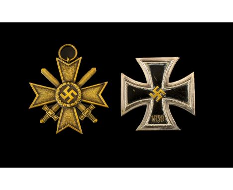 German WW2 War Merit Cross With Swords 2nd Class Makers Number To Ring 87 For Roman Palme. Together With An Unmarked Iron Cro